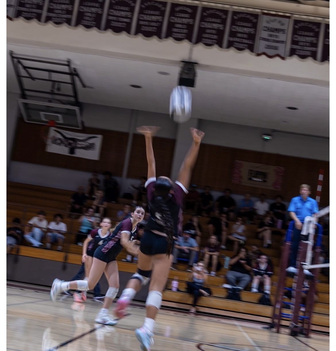 RBV varsity volleyball player jump serving during the LCC match