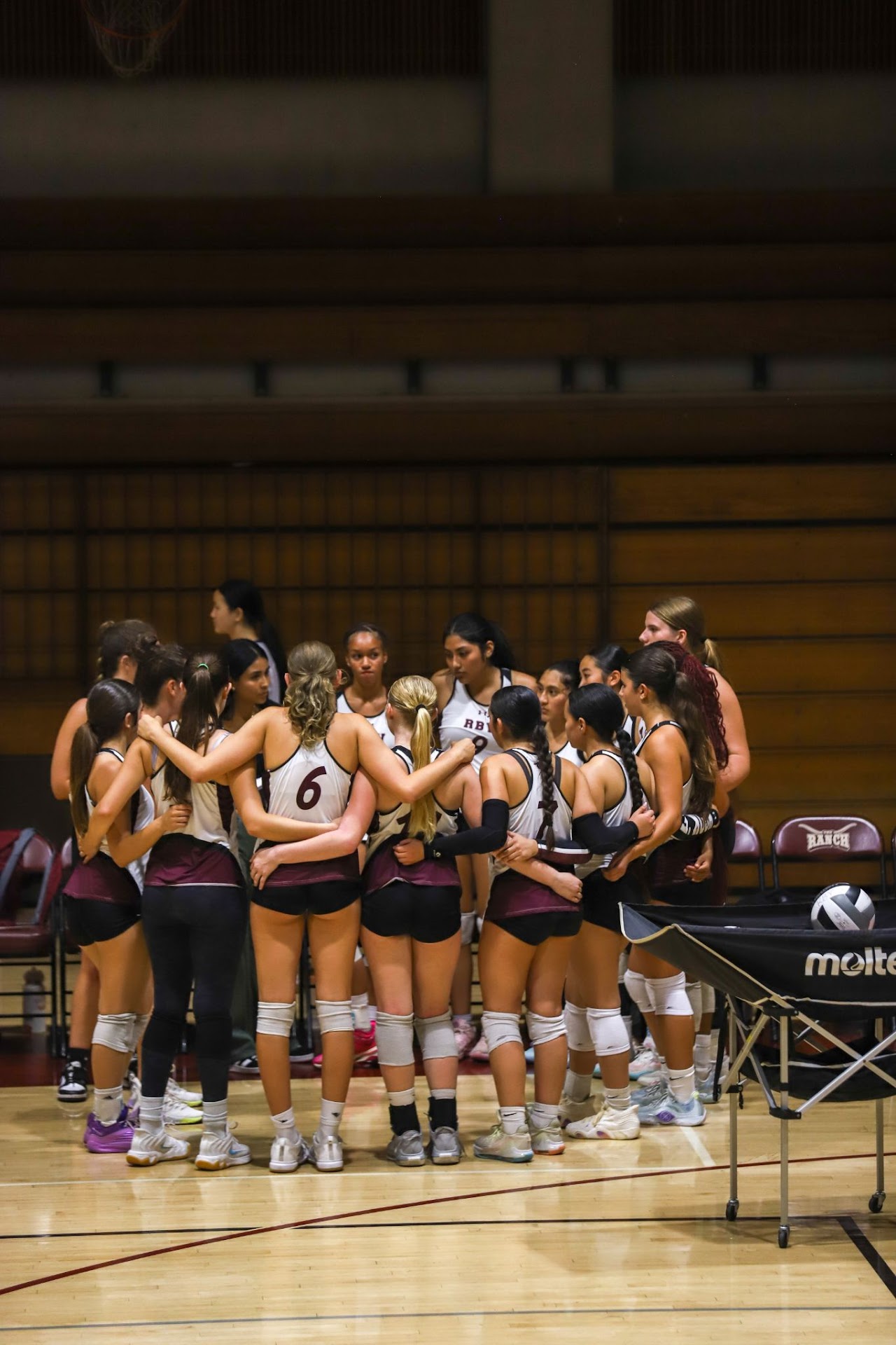 RBV Volleyball team huddle at Rancho Buena Vista High School
